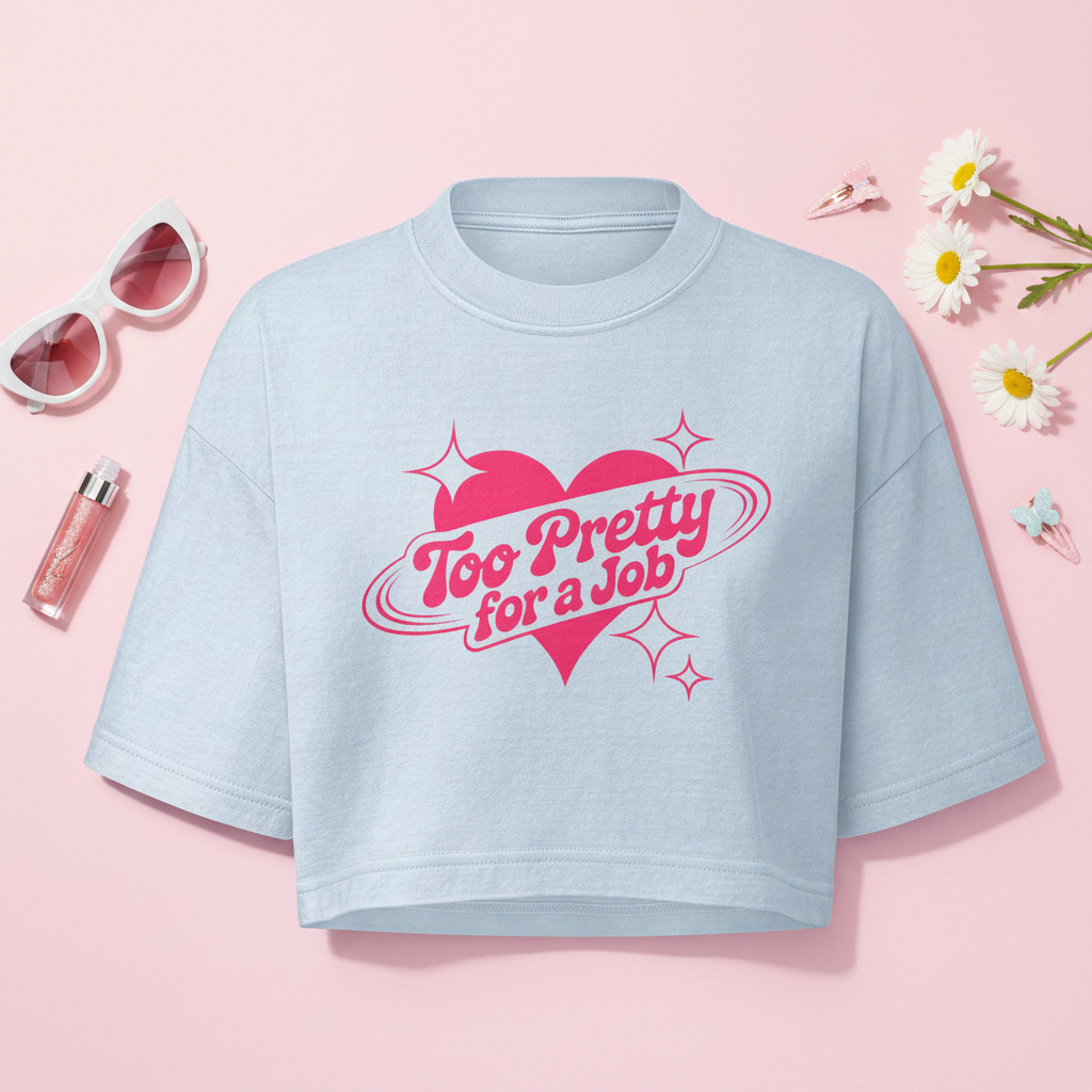 Flat lay of Too Pretty for a Job cropped tee with feminine accessories
