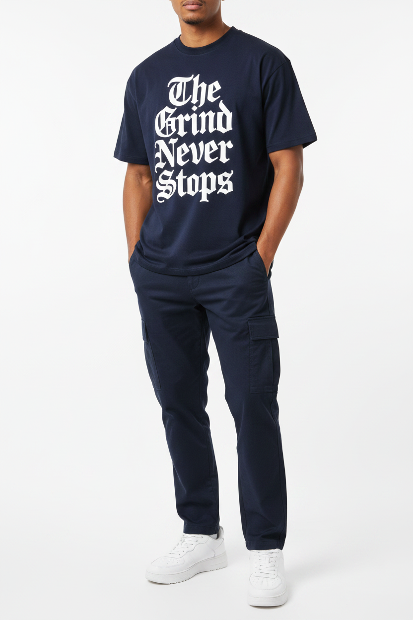 Editorial shot of The Grind Never Stops navy tee